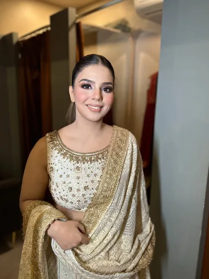 Karwachauth special. A beautiful, soft glam look for the festive day, featuring a sleek ponytail and glowing makeup.
