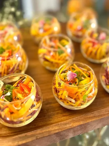 Colorful and refreshing salad cups, perfect for a light and healthy appetizer option. The vibrant presentation makes them a beautiful addition to any spread.