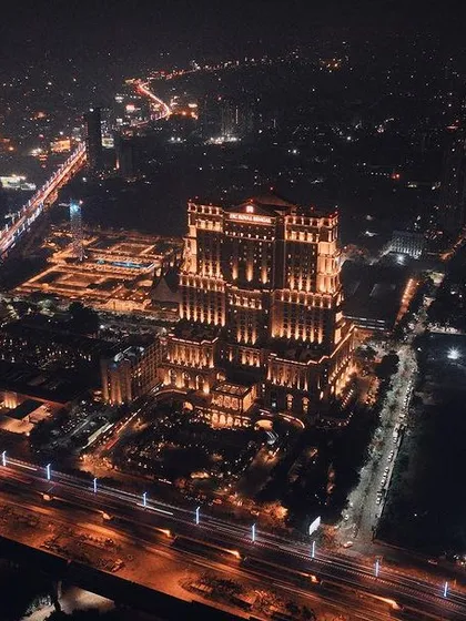 My work isn't just about remote resorts. I love capturing the energy of a city at night. This long-exposure drone shot over Kolkata highlights a modern architectural landmark against the flow of city traffic.