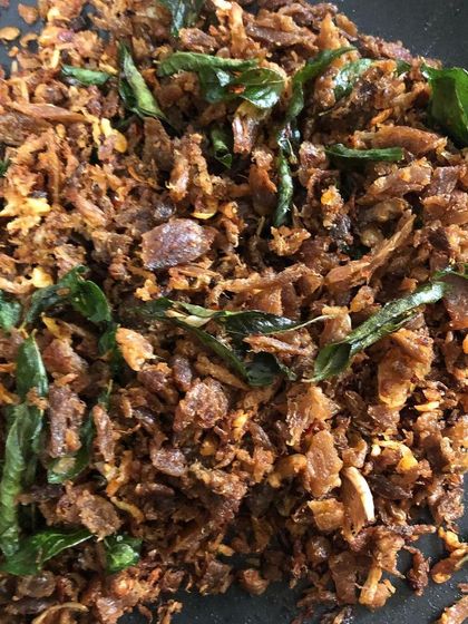 Sometimes a craving for the taste of 'onakkameen' (dried fish) from my childhood hits. When I can't find it, I get creative and make a quick version with canned tuna, fried with onions and curry leaves. It’s a simple, home-style snack.