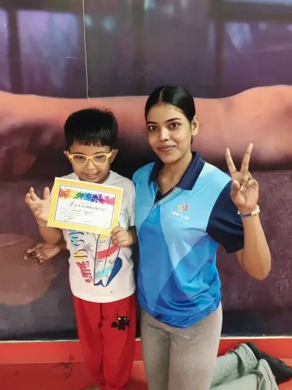This young athlete is all smiles after earning his certificate. We are proud of all our students.