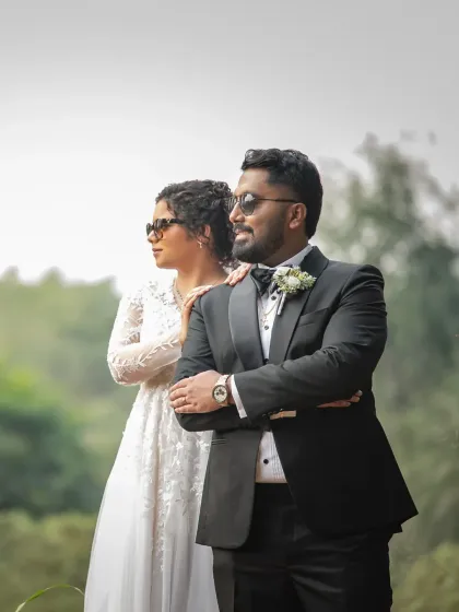 Cool, calm, and collected. This stylish wedding portrait has a modern, editorial feel, showing off the couple's confident and fun-loving personalities.