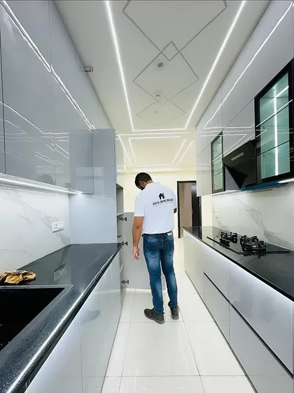 Checking the soft-close drawers and cabinets in this functional and stylish grey kitchen. Quality hardware is a key part of our promise.