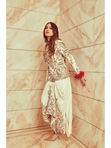 This Anamika Khanna outfit is fusion fashion at its best. The embroidered jacket paired with draped dhoti-style pants is edgy, artistic, and incredibly chic.