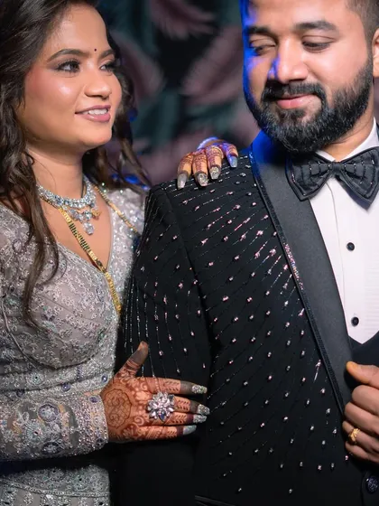 A sweet moment between the couple. The bride's makeup looks flawless from every angle.
