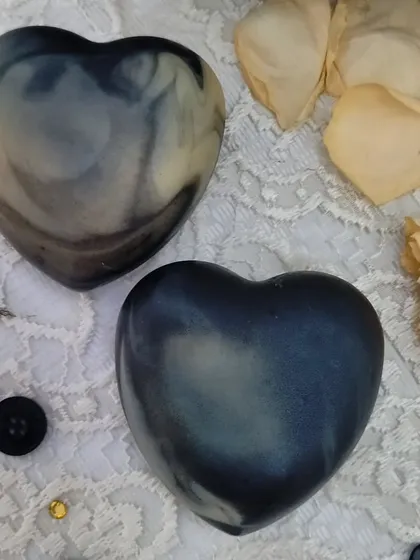 A different angle of the heart-shaped Lush Lavender soaps, showing their depth and unique coloring.