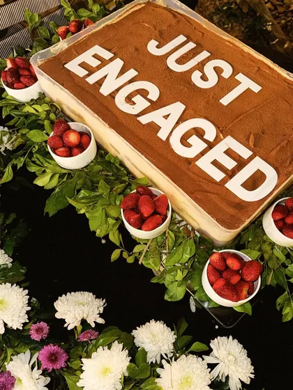I love being a part of your special moments. This large-format Tiramisu was for a "Just Engaged" party, complete with fresh strawberries and flowers. We can customize our signature desserts to make your celebration even sweeter.