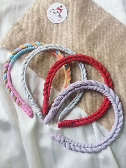 Our twisted tiara headbands are available in so many lovely colors, like this collection of red, grey, lavender, and multi-color.