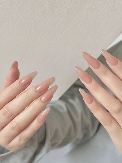 Simple, elegant, and clean. These long, translucent nude extensions in a stiletto shape are the definition of understated chic.