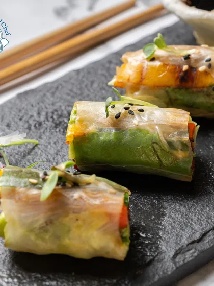 A close-up of my Vietnamese Rice Paper Rolls, showing the fresh, vibrant ingredients wrapped in delicate rice paper. This is a healthy, light, and elegant appetizer choice.