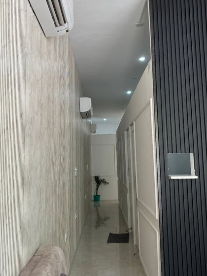 A look at the clean and well-maintained corridor at my clinic. I ensure the highest standards of hygiene and a peaceful atmosphere for all my patients.
