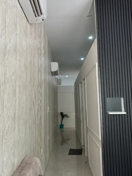 The clean and serene hallway of my clinic. I prioritize a hygienic and calm environment for all my patients.