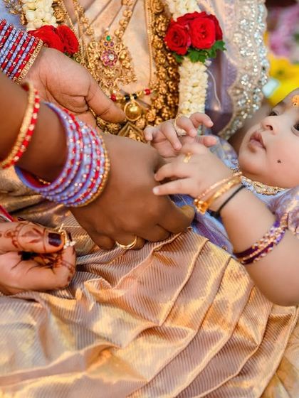 Focusing on the details, this photo shows the baby's hands during the ceremony. These small moments are just as important as the big ones.