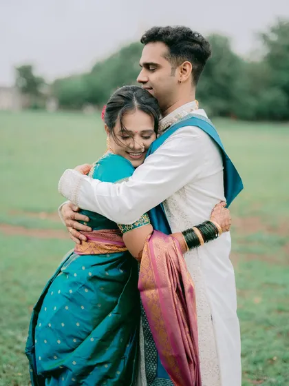 A warm, heartfelt hug captured in an open field. This image is all about the emotion of the moment, showing the comfort and love the couple shares.