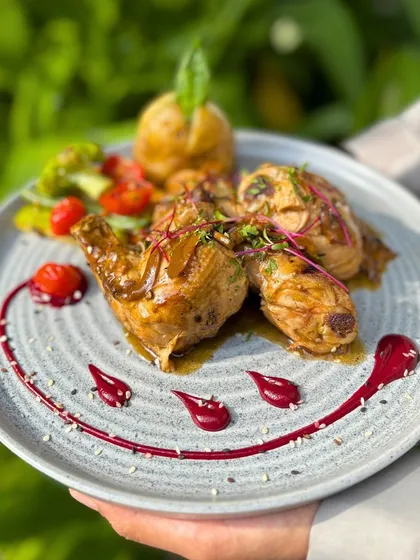 A beautifully plated Halgali's Roast Chicken, with a smile made of beetroot reduction. I believe food should be fun and make you happy.
