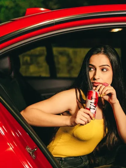 Another shot from the Tilt campaign, capturing a candid moment in the back of a car. This "party on the go" concept highlights the convenience and fun of the product.