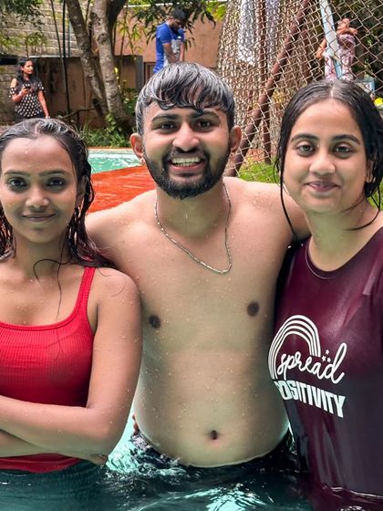 Posing with friends in the pool. It's all about having a good time together.