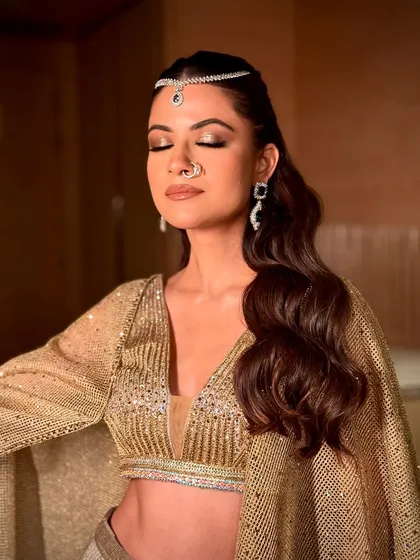 A serene moment showing the beautiful, shimmering eyeshadow. The golden tones are blended perfectly for a soft yet impactful finish.