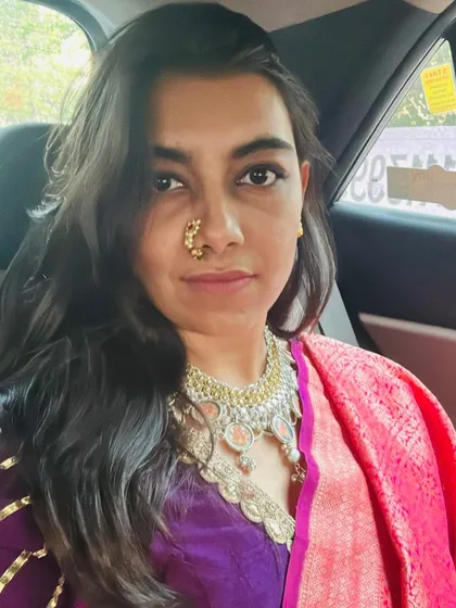 A self-portrait of our co-founder showcasing a vintage 'maharani' look. It highlights our love for reviving dying art forms, like hand-painted miniature pendants, and incorporating them into modern styling.
