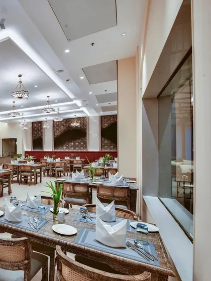 The all-day dining restaurant at The Fern Sattva Resort, where we used rustic wooden furniture and a clean, open layout. The design ensures a comfortable and sophisticated dining experience that complements the resort's sustainable hospitality ethos.