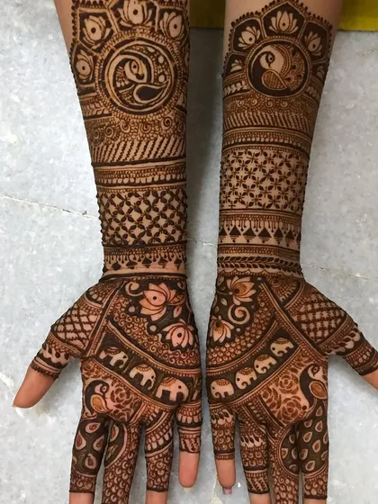 I feel so proud when I see the work my students create. This is a full bridal mehndi design, complete with intricate details like elephants and peacocks, all done by one of my talented daughters after taking my course.