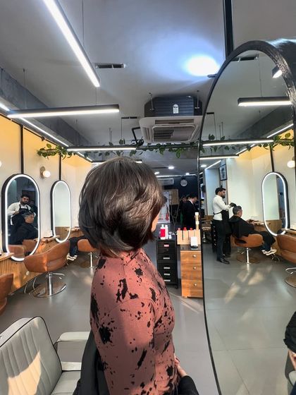 A short, layered haircut that is both stylish and easy to manage. The layers add texture and volume to the hair.