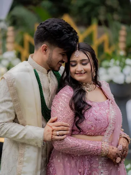 Capturing pure joy requires makeup that feels as good as it looks. Here, I created a fresh, dewy base with soft pink tones on the eyes and cheeks to complement the bride's pastel lehenga, resulting in a radiant and natural glow.
