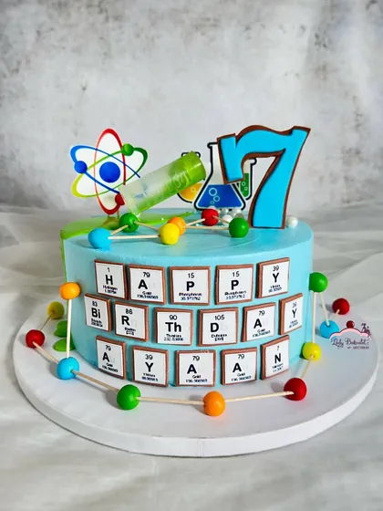 A cake for a science buff! This design features the periodic table spelling out "Happy Birthday" and colorful molecule models.