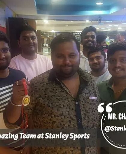 Celebrating with friends makes victory even sweeter. This champion is joined by his group after a successful session at our indoor range.