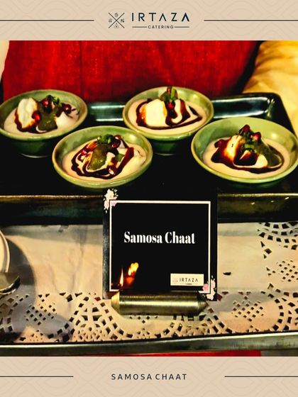 A classic Samosa Chaat, deconstructed and served in individual bowls with yogurt, tamarind chutney, and fresh herbs.
