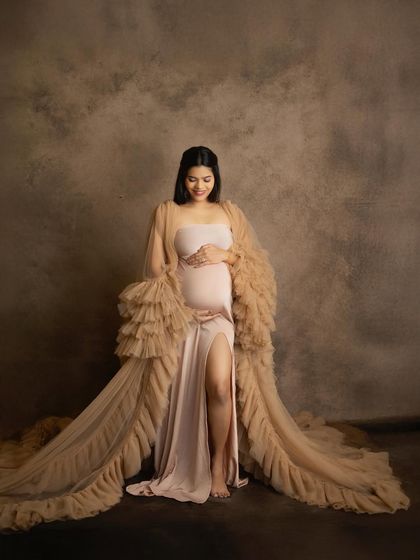 A gentle smile and a loving hand on the bump. This full-length portrait showcases one of my favorite gown combinations, creating a look of pure elegance and grace.