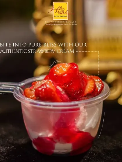 A close-up of our delightful Strawberry Cream dessert. The vibrant red of the fresh strawberries against the white cream, served in a convenient cup, makes for a visually appealing and delicious treat.