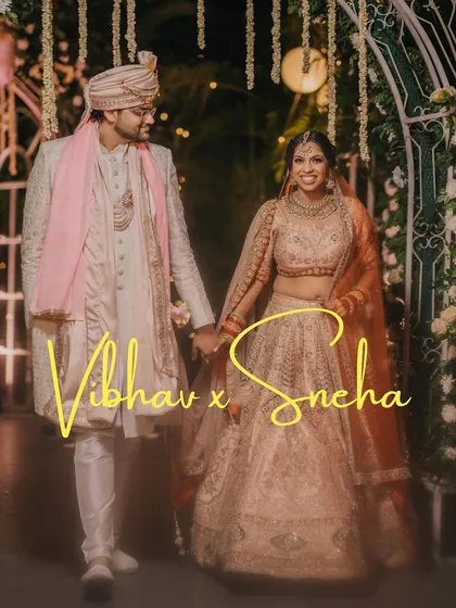 Vibhav and Sneha take their first steps together as husband and wife, walking hand in hand under a beautifully lit archway. This is the beginning of their forever journey.