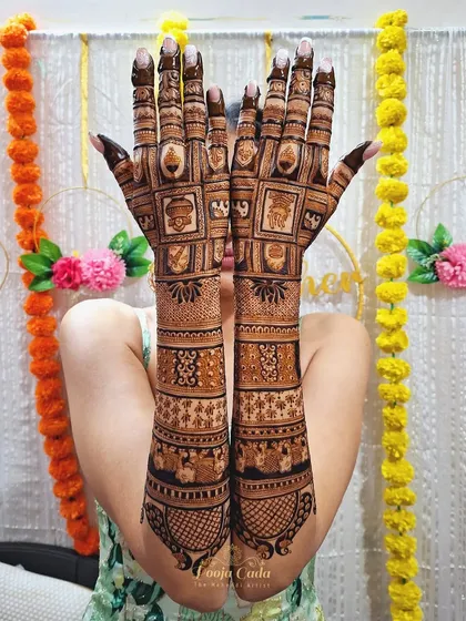 Another happy bride showcasing her beautiful back-hand design, filled with intricate patterns and traditional motifs.