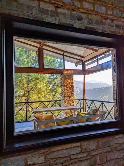 A window within a window, this view from the dining room looks out onto the covered terrace, creating a layered experience of the indoor and outdoor spaces.