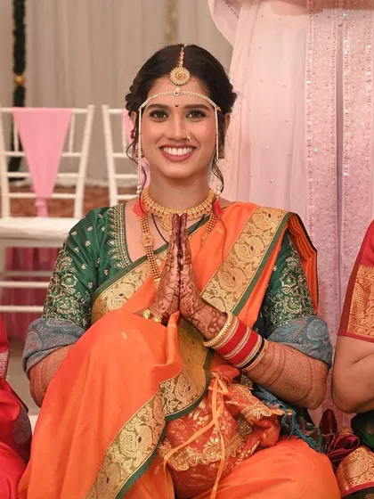 A moment of pure joy and tradition. Our Maharashtrian bride looks serene and beautiful during her wedding ceremony, with her hands joined in a respectful namaste.