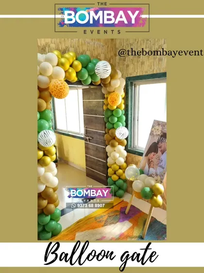 This jungle-themed balloon arch uses multiple shades of green, gold, and textured balloons. This type of organic balloon design is very modern and can be adapted to create an elegant entrance for a corporate gala or event.