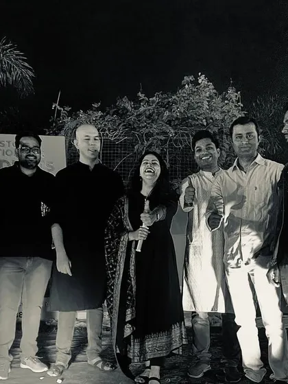 A successful event ends with a happy team. A group photo with some of the performers and crew.