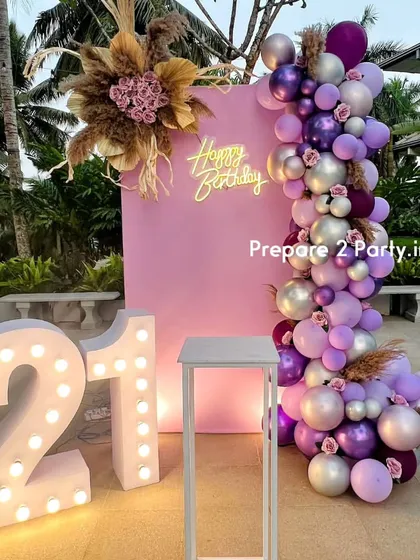 My 21st birthday decorations range from bold and modern to soft and elegant. I use marquee numbers, custom backdrops, and sophisticated balloon arrangements to mark this special occasion.