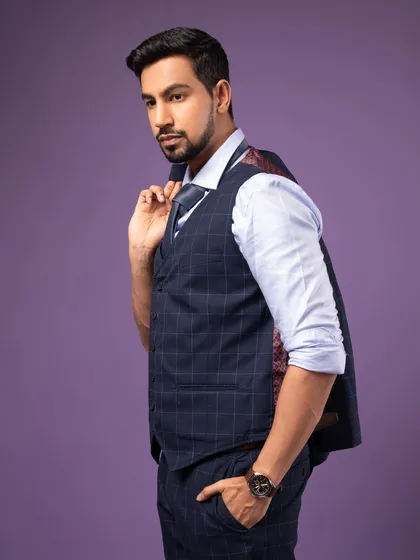 A dynamic pose with the jacket slung over the shoulder. This adds a bit of personality and is great for a more creative professional's headshot.