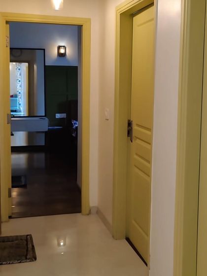 A look at the colorful doors and entryway of our Lotus Boulevard project. We used a cheerful yellow paint to brighten up the space and give it a unique character.