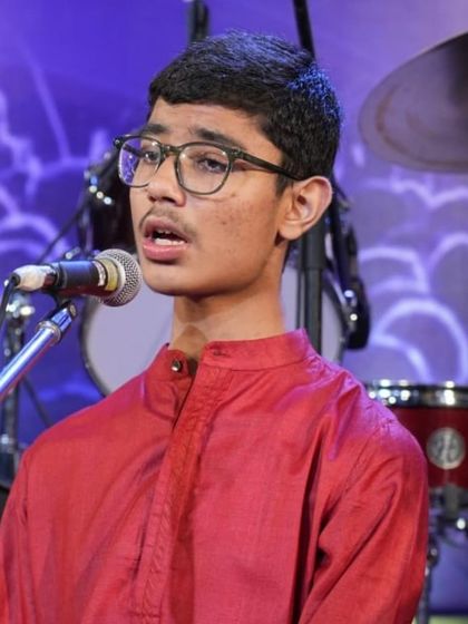 A portrait of student Animesh, capturing the emotion of his vocal performance.