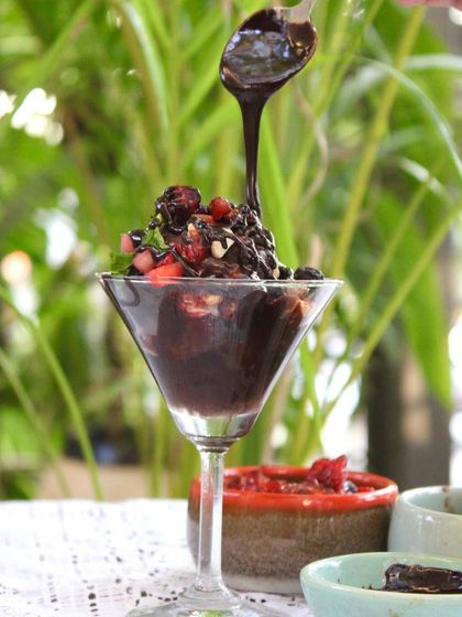 Watch the rich chocolate sauce being drizzled over our homemade Chocolate Sundae. It's a moment of pure, unadulterated joy.