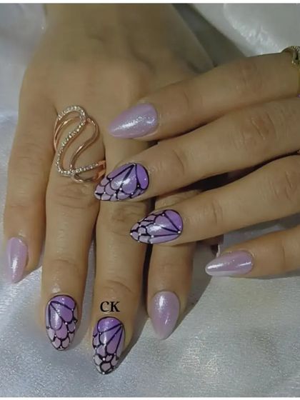 Another angle of the intricate, hand-painted butterfly wing art.