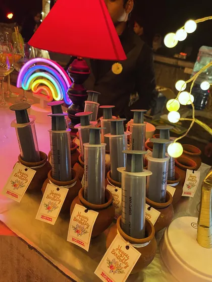Another view of our popular syringe shots, presented in small earthen pots (matkas) with custom "Happy Birthday" tags. This is a great example of how we tailor our presentation to the specific event.