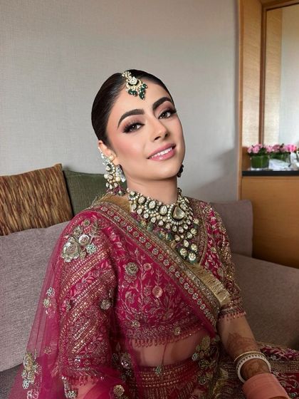 A portrait of a beautiful bride with her hair in a sleek, classic bun, ready for her wedding day.