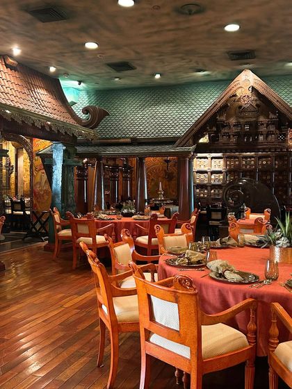 A wider shot of the dining room at The Spice Route. This showcases the grand scale and immersive atmosphere of the restaurant, a key part of its appeal.
