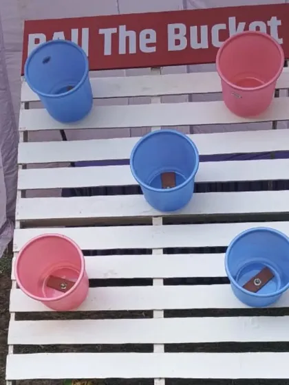 The "Ball the Bucket" toss game is a simple yet challenging activity suitable for all ages. It's a great addition to a series of carnival stalls for a birthday party or college festival.