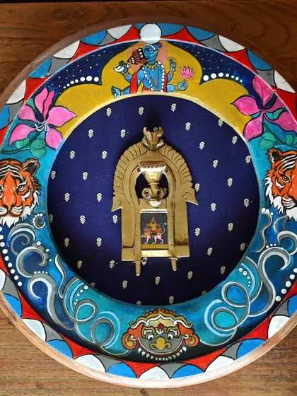 The completed Rahu frame, a hand-painted depiction of the conqueror of the sun and moon. The artwork features his tiger mount and the Varaha avatar of Vishnu, surrounded by a whirlwind of color and cosmic energy.