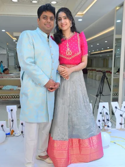 The happy couple, with our client looking beautiful in her pink and grey lehenga and her partner in a coordinating blue kurta.